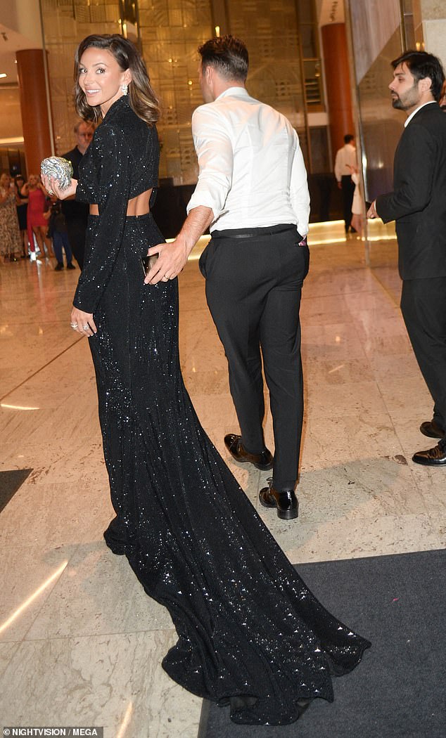 Glam! Michelle and her husband Mark Wright arrived at the Intercontinental Hotel before changing into comfier clothes