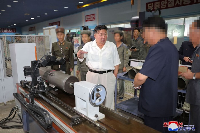 North Korean leader Kim Jong Un inspects a marine engine factory in North Pyongan province in a photo released by state media on Sunday