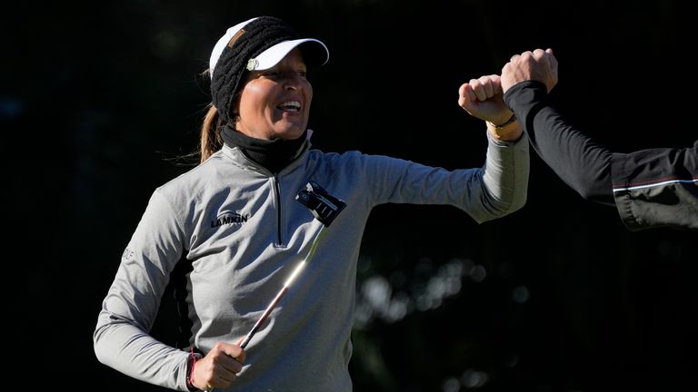 Perrine Delacour celebrates with her caddy after staying bogey-free for the second day straight