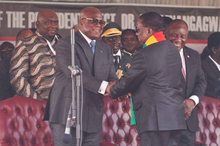 Zimbabwe president Emmerson Mnangagwa at his inauguration in Harare, shaking hands with Democratic Republic of Congo president Felix Tshisekedi on September 4 2023