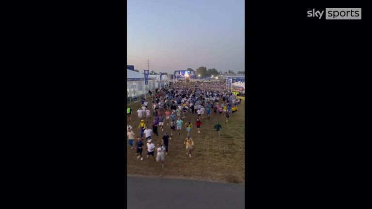 Fans can be seen sprinting through the gates as the 44th Ryder Cup gets underway. Credit: @RyderCup