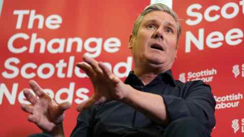 Kier Starmer in front of Labour banner