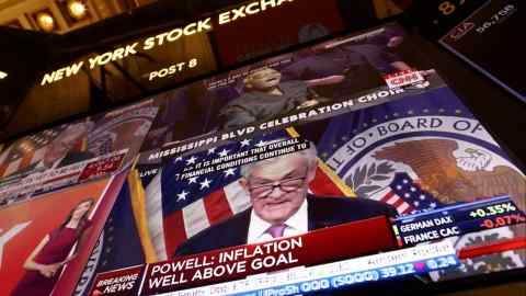 Federal Reserve chair Jay Powell appears on a screen on the trading floor of the New York Stock Exchange