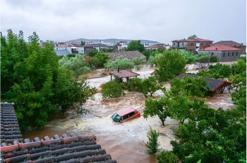 Cars and homes taking in water at Volos on Tuesday