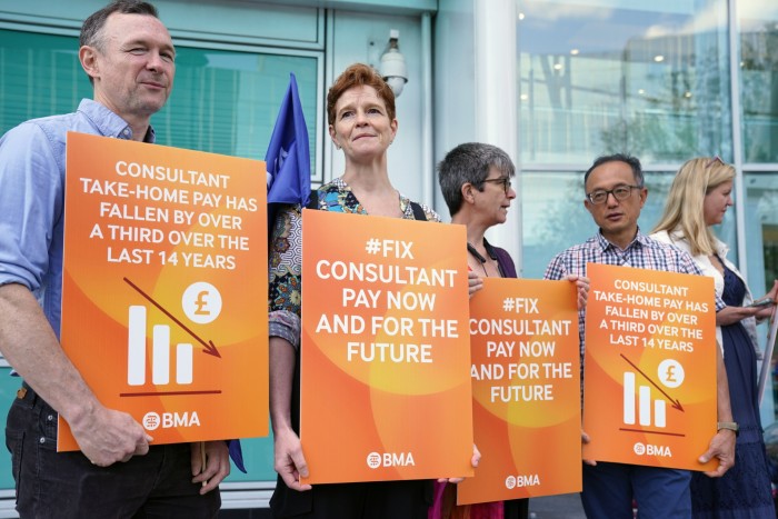 Striking consultants on a picket line in London in July 