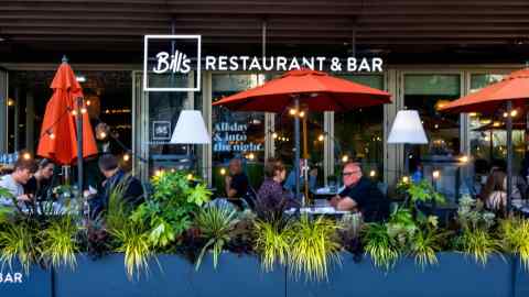 People dine outside at a restaurant in Southampton, Hampshire