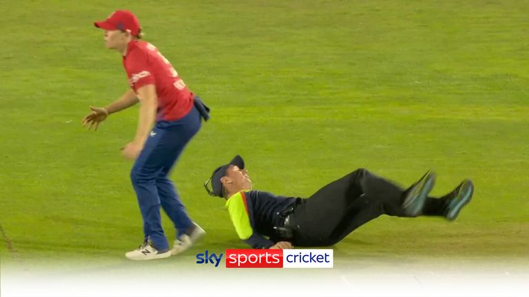 'Hit the ground or take out the captain! | Umpire takes a tumble!