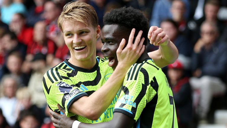 Goalscorers Martin Odegaard and Bukayo Saka celebrate during Arsenal&#39;s Premier League clash with Bournemouth