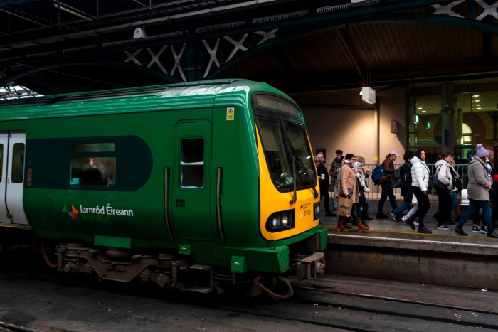 A green train at a Dublin station 