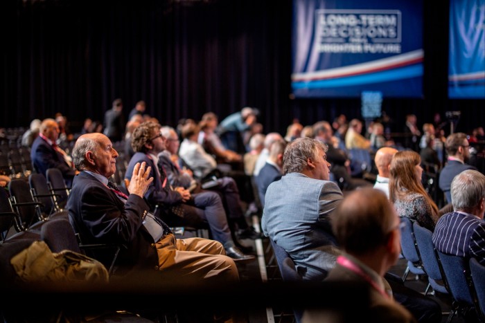 Delegates seated inside the conference hall