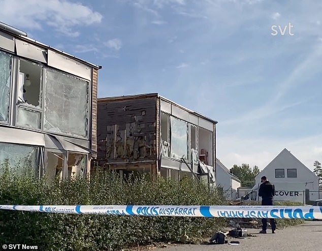 Footage of the bomb's aftermath shows the young woman's building ripped apart, the smashed windows hanging haphazardly down the front of her home in a scene that witnesses have likened to a war zone