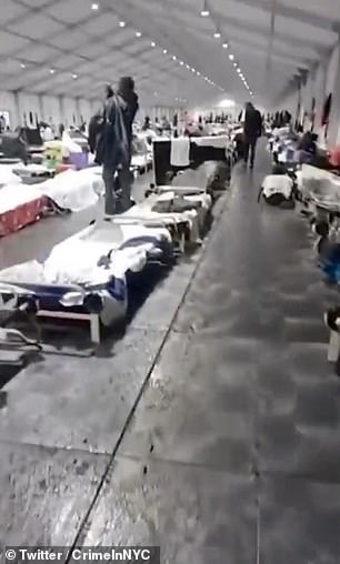 Footage shared online of the tent shelters shows rain leaking into the facility, coming in from the floorboards and the temporary roofs