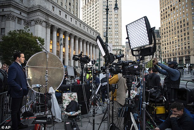 Members of the press gathered outside as the Trump circus returned to New York