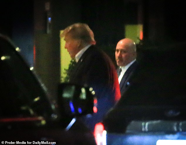 Flanked by Secret Service and NYPD officers, Trump was wearing a navy blue suit, white button down shirt and going without a tie as he walked in