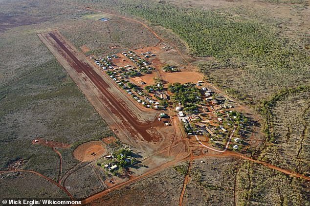 The girls and two adults come from Lajamanu (above) a tiny desert community half way between Darwin and Alice Springs in the Northern Territory