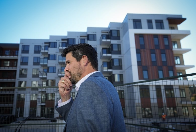 Sean Fraser, Minister of Housing, Infrastructure and Communities, prepares to speak during a housing announcement outside a rental housing building being developed by the University of British Columbia Properties Trust, in Vancouver.