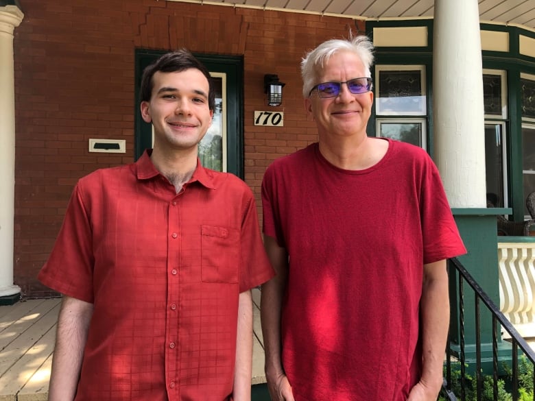 smiling son and dad duo