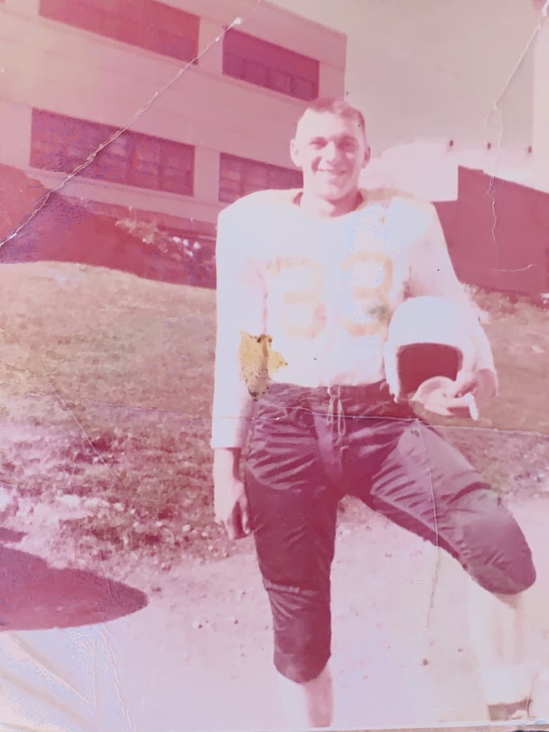 A photo of a man in a football kit. 