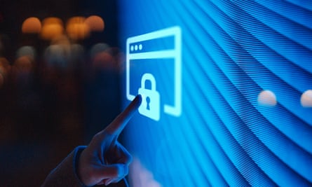 Close-up of female hand touching illuminated digital screen displaying a locked sign