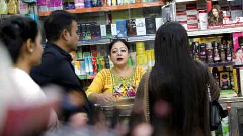 Staff at a cosmetics store in Kolkata, India