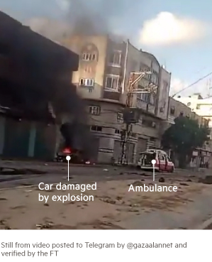 A photo showing a car damaged by an explosion and the ambulance that arrived on the scene to help