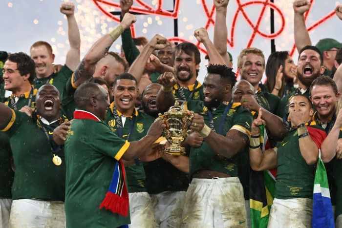 South Africa’s president Cyril Ramaphosa and team captain Siya Kolisi hold the World Cup trophy