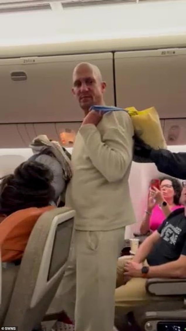 Bizarre moment woman throws £5,000 in cash at man on runway after ‘drunken row’ forces London to Bangkok flight to divert to Austria and they are led away by police