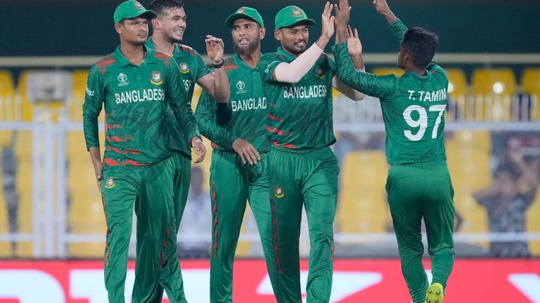 Bangladesh players celebrate the wicket of England&#39;s Liam Livingstone during the ICC Cricket World Cup warm up match between Bangladesh and England in Guwahati