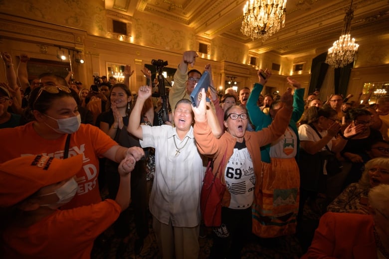 Manitoba NDP supporters cheer upon learning the party was elected or leading in more than 29 ridings -- the number required to form a majority government -- at the party's election headquarters at the Fort Garry Hotel in downtown Winnipeg on Oct. 3, 2023.