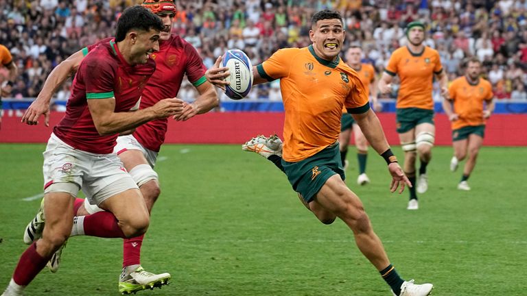 Australia's Izaia Perese runs with the ball during the Rugby World Cup match against Portugal in Saint-Etienne