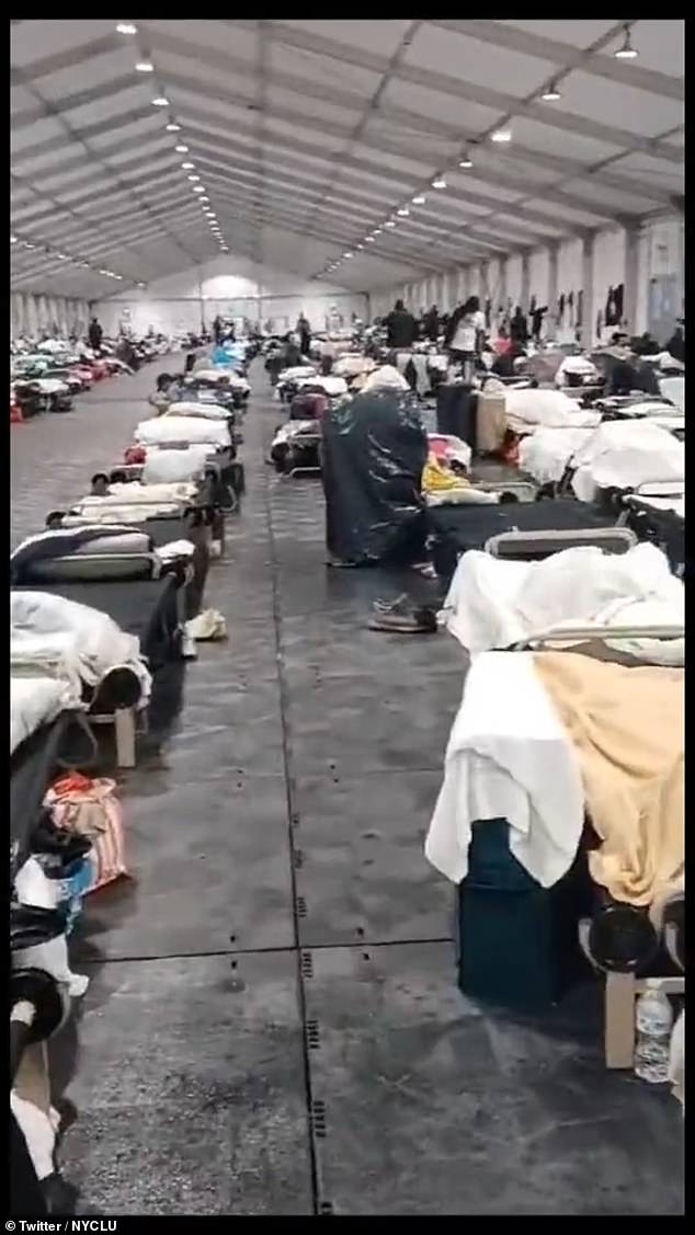 NYC’s $20M-a-month migrant tent on Randall’s Island is LEAKING as desperate asylum seekers are forced to sleep under trash bags to shelter from the rain