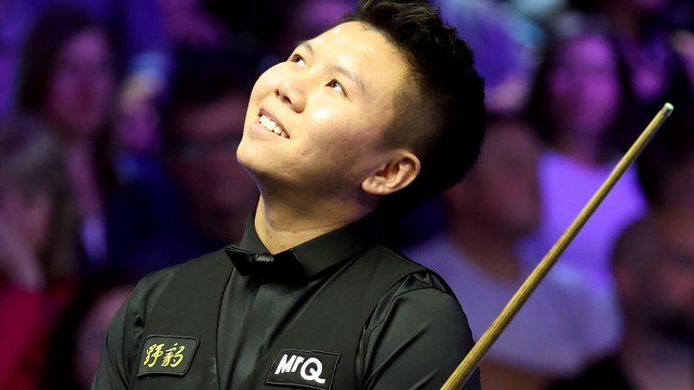 Zhou Yuelong beat John Higgins to set up a quarter-final meeting with O'Sullivan