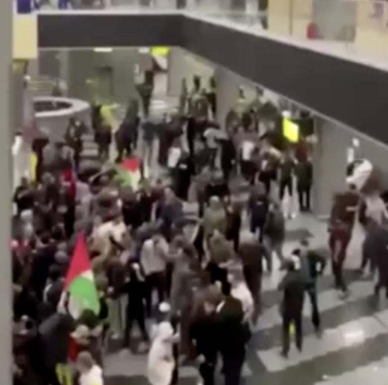 A still image of a video taken of the Makhachkala airport on October 29, 2023 when hundreds of mostly young men gathered to find Jewish passengers who they believed were arriving on a flight from Israel. 