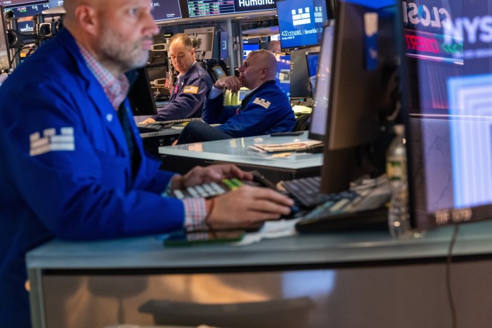 Traders work on the floor of the New York Stock Exchange on Tuesday.