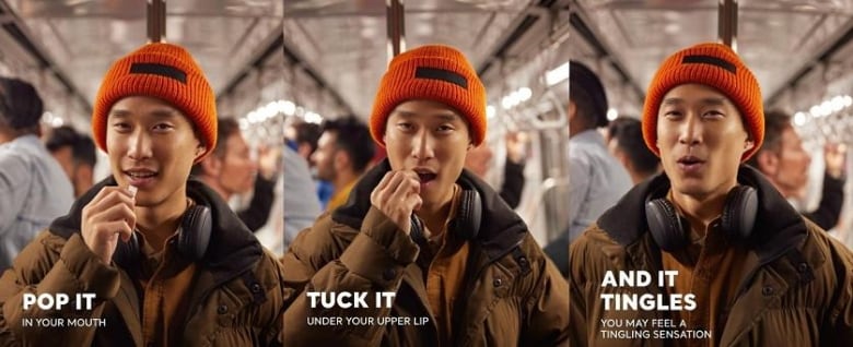 An ad shows a man on a bus with a slightly suprised expression with writing that says "pop it in your mouth"