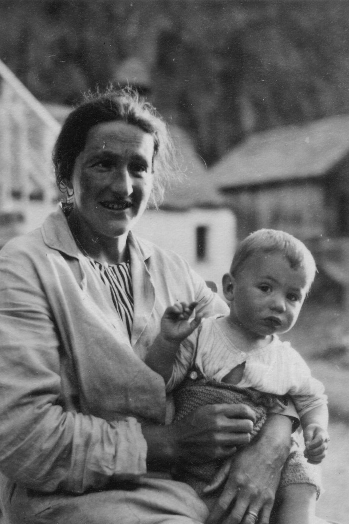 A black-and-white photograph, circa 1930s, of a woman holding a baby boy