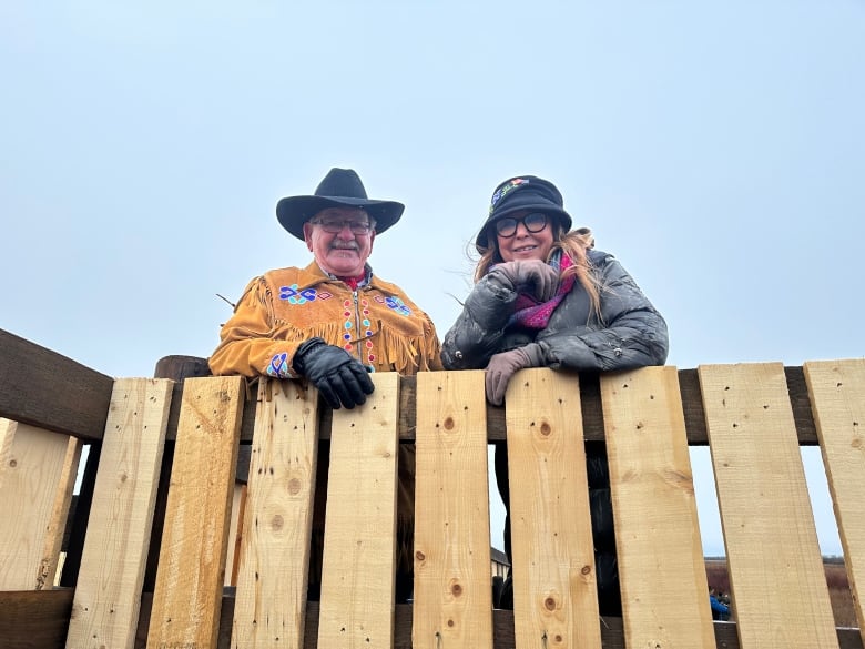 Métis Nation-Saskatchewan Vice-President and Environment Minister Michelle LeClair looks down on the 25 bison transferred from Grasslands National Park to MN-S lands near Batoche National Historic Site. 