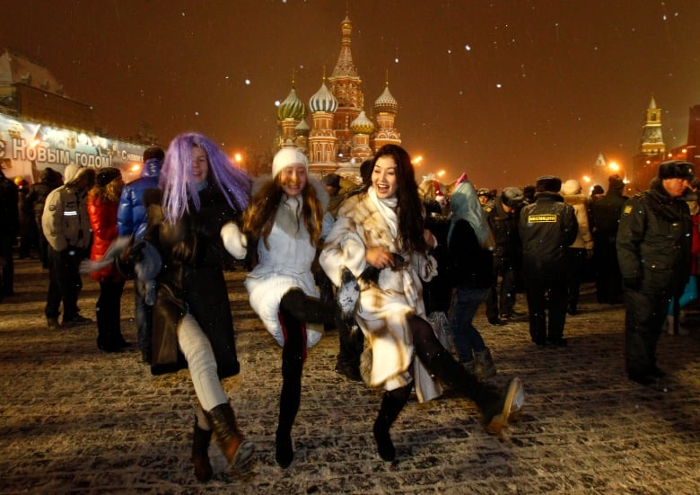 People celebrate ahead of New Year's Day in Red Square in Moscow.