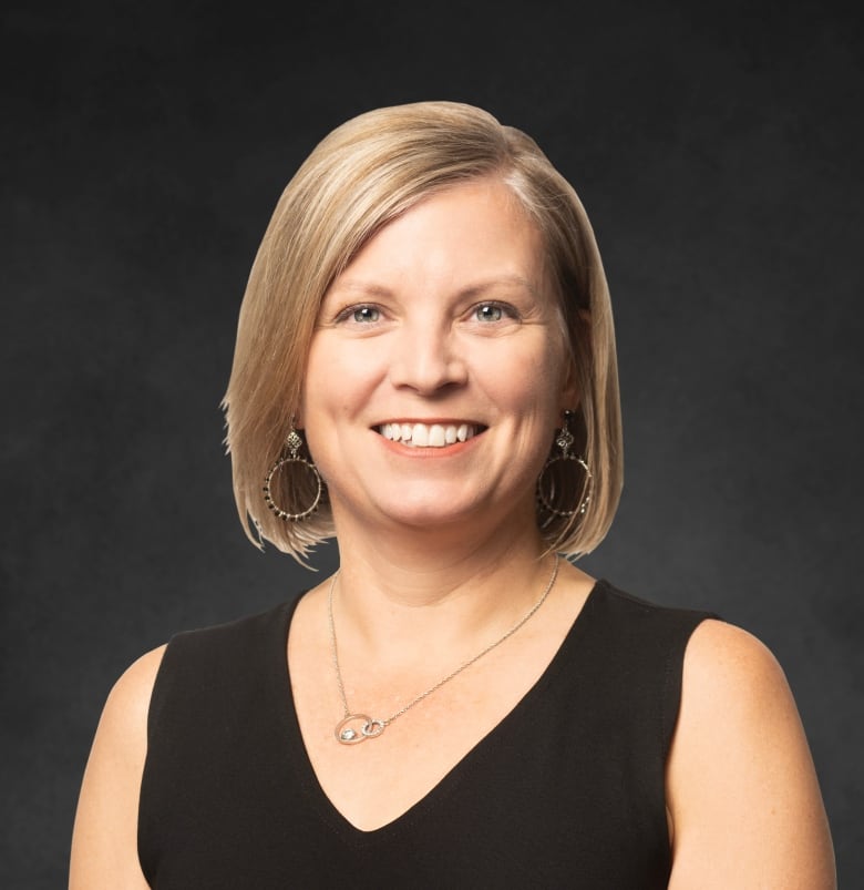 Dr. Shelley Duggan is an Edmonton-based critical care physician and the Alberta Medical Association's president-elect. She has blonde hair and is wearing a black v-neck blouse.