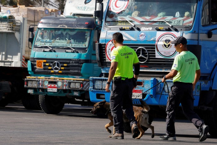 Israeli customs officers at the small Nitzana crossing inspect trucks with humanitarian aid supplied bound for Gaza