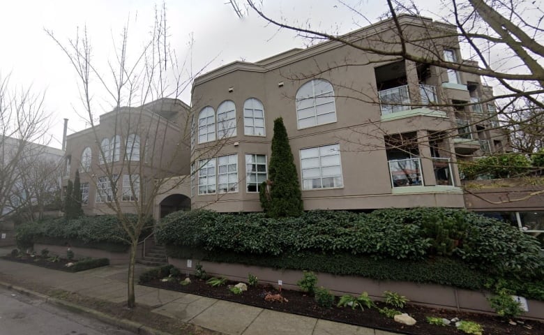 An image taken from the street view feature on Google Maps shows a low-rise beige condo building.