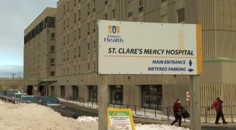 A grey exterior of a hospital with a sign that reads St. Clare's Mercy Hospital.