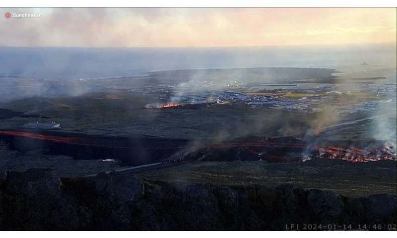 Iceland faces daunting period after lava from volcano destroys homes in fishing town, president says