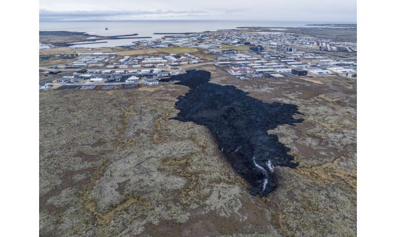 Iceland faces daunting period after lava from volcano destroys homes in fishing town, president says