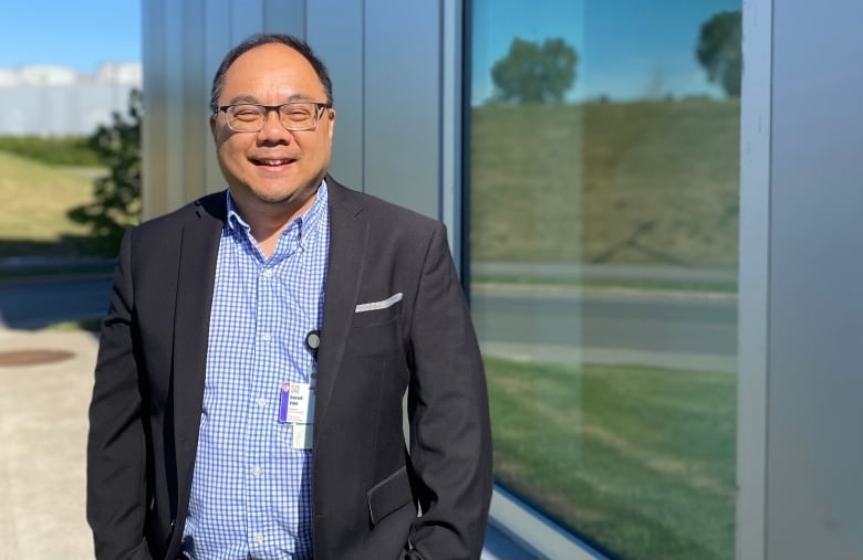 Portrait of Dr. Donald Vinh, outdoors. 