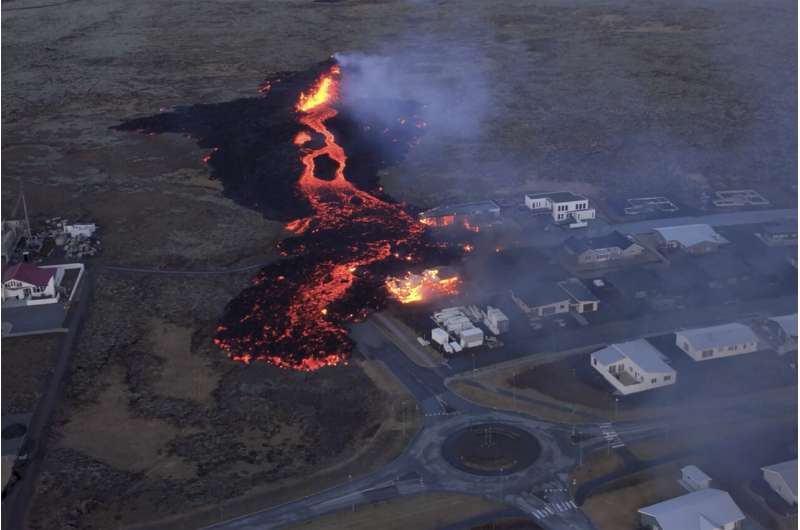 Iceland faces daunting period after lava from volcano destroys homes in fishing town, president says