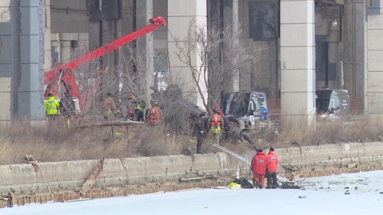 First responders on the scene of a car crash near Lake Ontario.