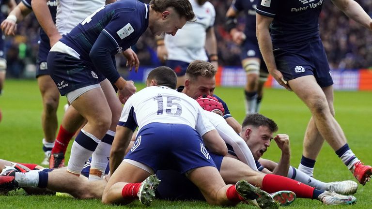 Ben White got the first try on the board for Scotland as he slid over in the rain 