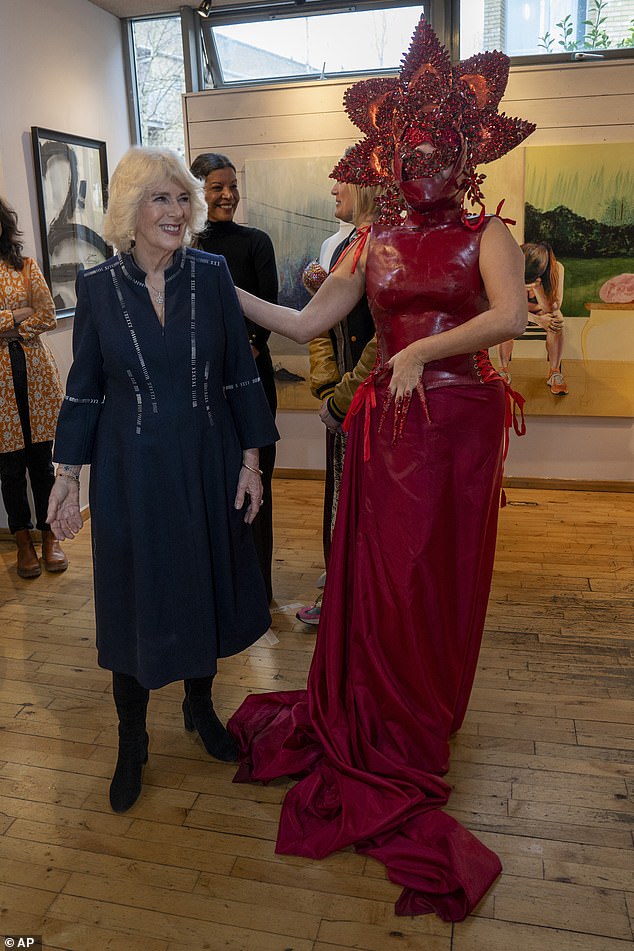 Camilla, left, meets costume designer Syban Velardi-Laufer during her visit to Kindred Studios' Shepherds Bush pop-up hub