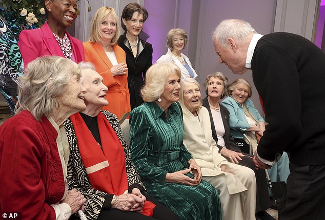 Camilla,, centre, speaks with host Gyles Brandreth, at the "Celebration Of Shakespeare" at Grosvenor House, in London